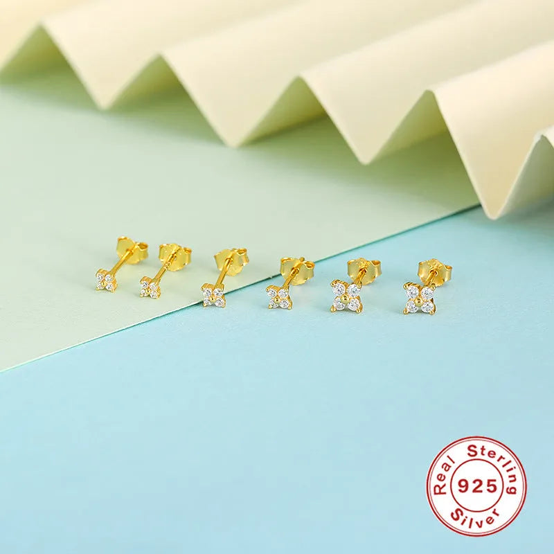 S925 sterling silver stud earrings with small crystal flower petals in gold and platinum finishes.