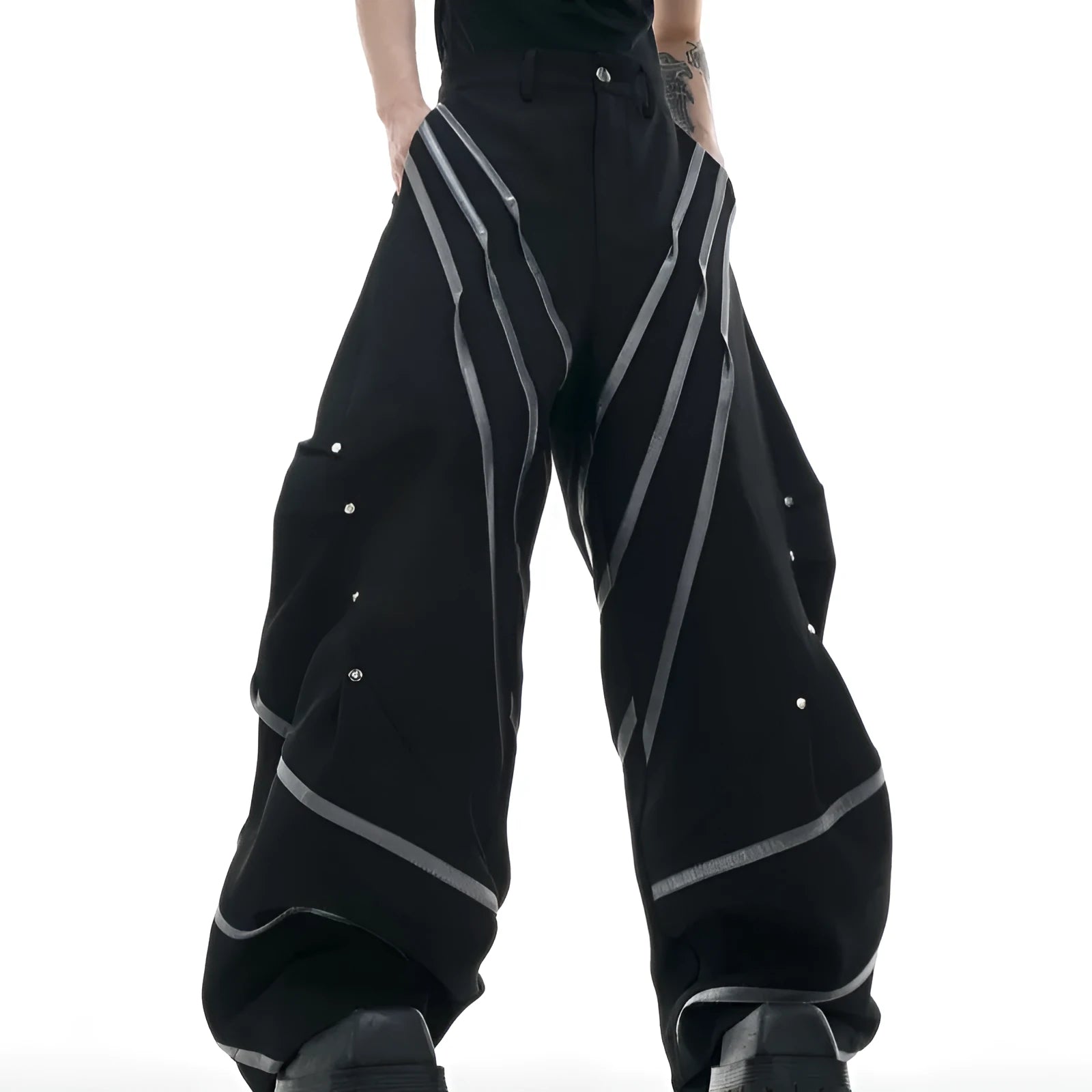 Men's polyester trousers with three-dimensional cut, metal striped rivets, and pleated front.