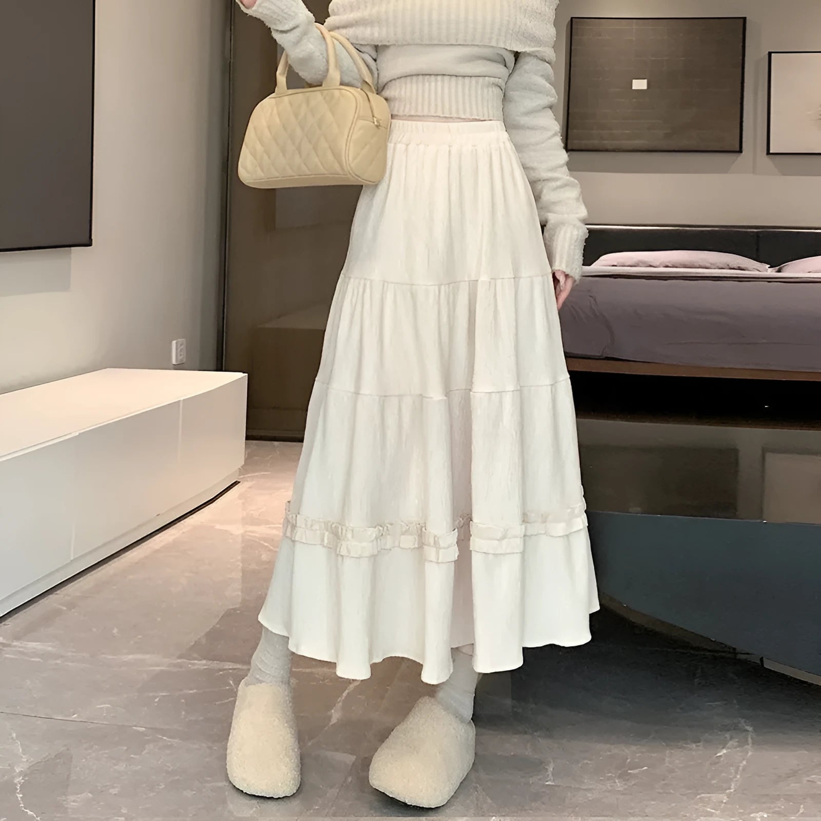 Corduroy A-line midi skirt with elastic waistband in beige, black or brown colours showing Korean style slimming silhouette