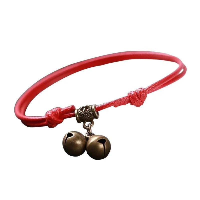Adjustable nylon dog collar with a choice of brass bell or brass buckle in black, red, or coffee colour.