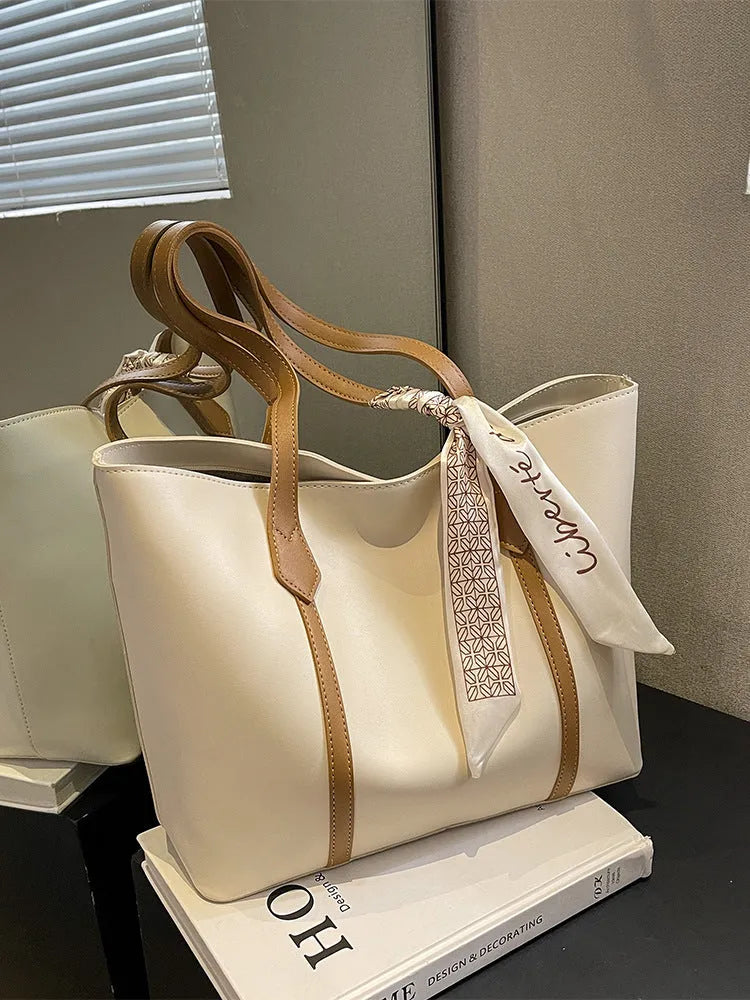 Large capacity bucket tote bag with soft construction and sandwich pocket design