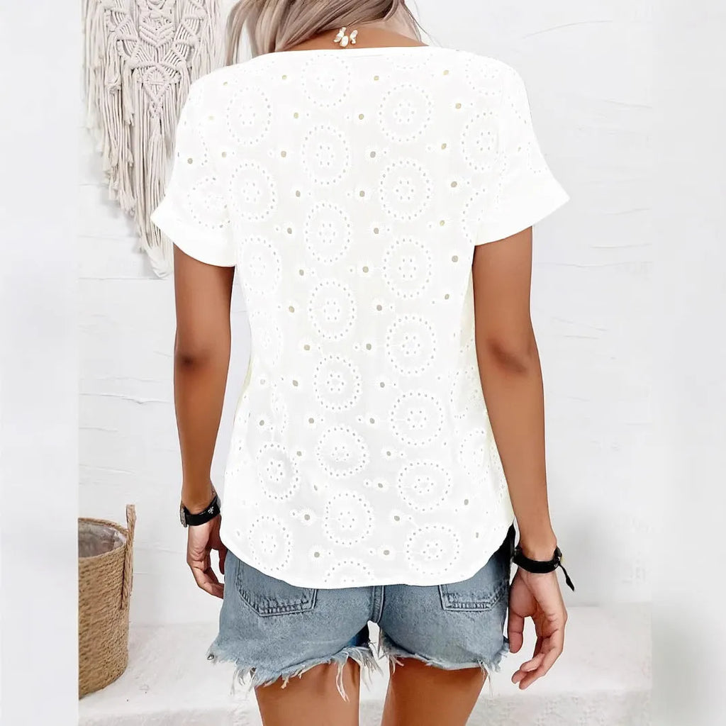 White loose fit V-neck t-shirt with hollow out detailing on the front.