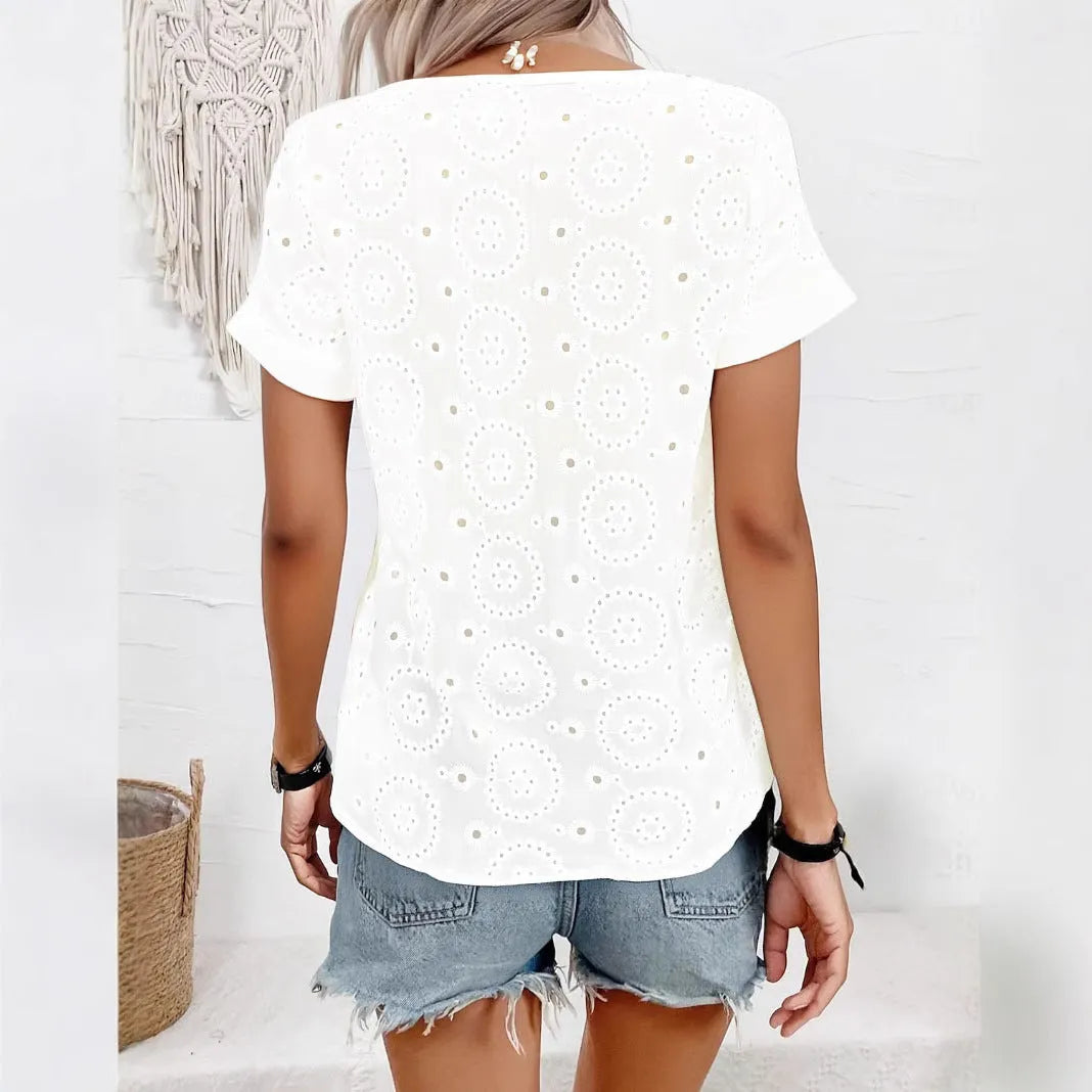 White loose fit V-neck t-shirt with hollow out detailing on the front.