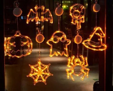 Halloween window hanging LED lights with suction cups showing multiple horror-themed designs powered by batteries