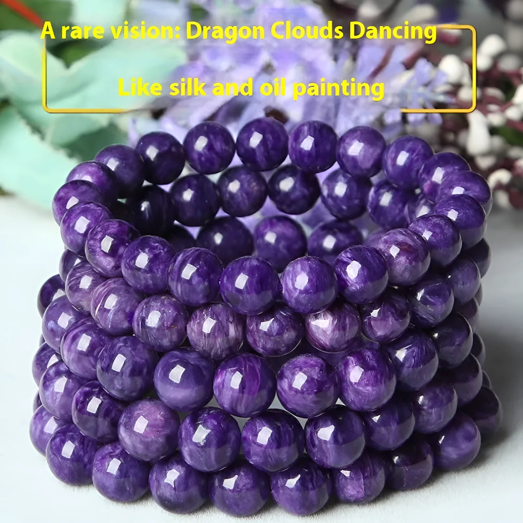 Natural transparent charoite crystal bracelet with platinum settings on wrist.