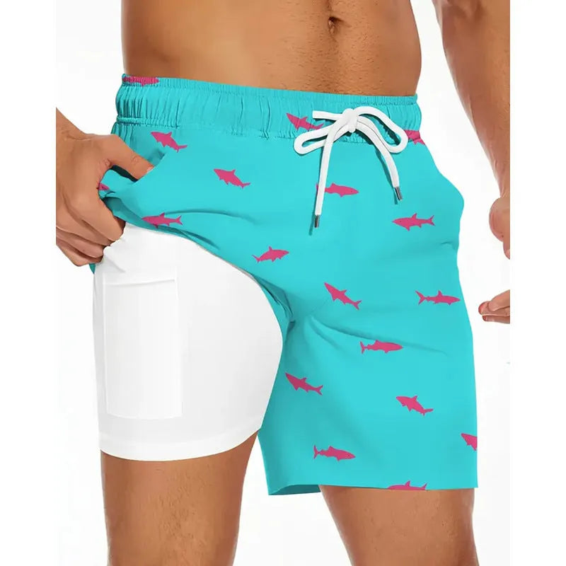 Man wearing loose light blue polyester beach pants on sand, showing plus size fit.