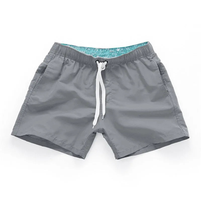 Men's plus size straight-leg beach shorts in multiple colours on a size chart.