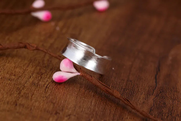 Geometric adjustable open ring with frosted sterling silver finish and Korean-inspired design