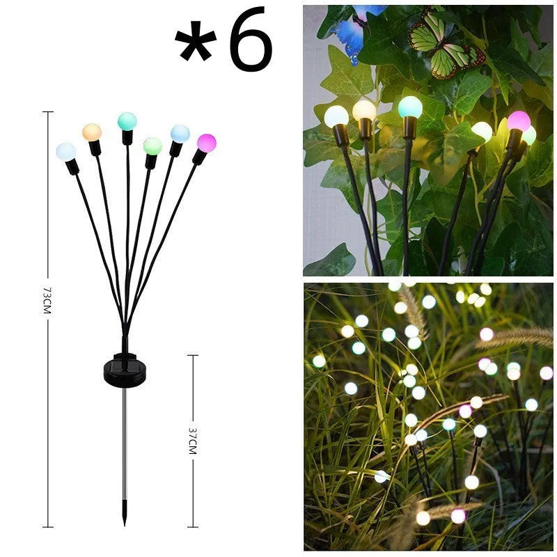 Solar-powered LED ground spike garden light with multiple heads and stainless steel soil plug.