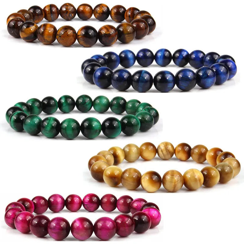 Tiger eye crystal stone bracelet showing round beads available in multiple colours and sizes on a wrist.