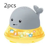 Automatic water spray whale bath toy with colourful LED lights floating in baby bath