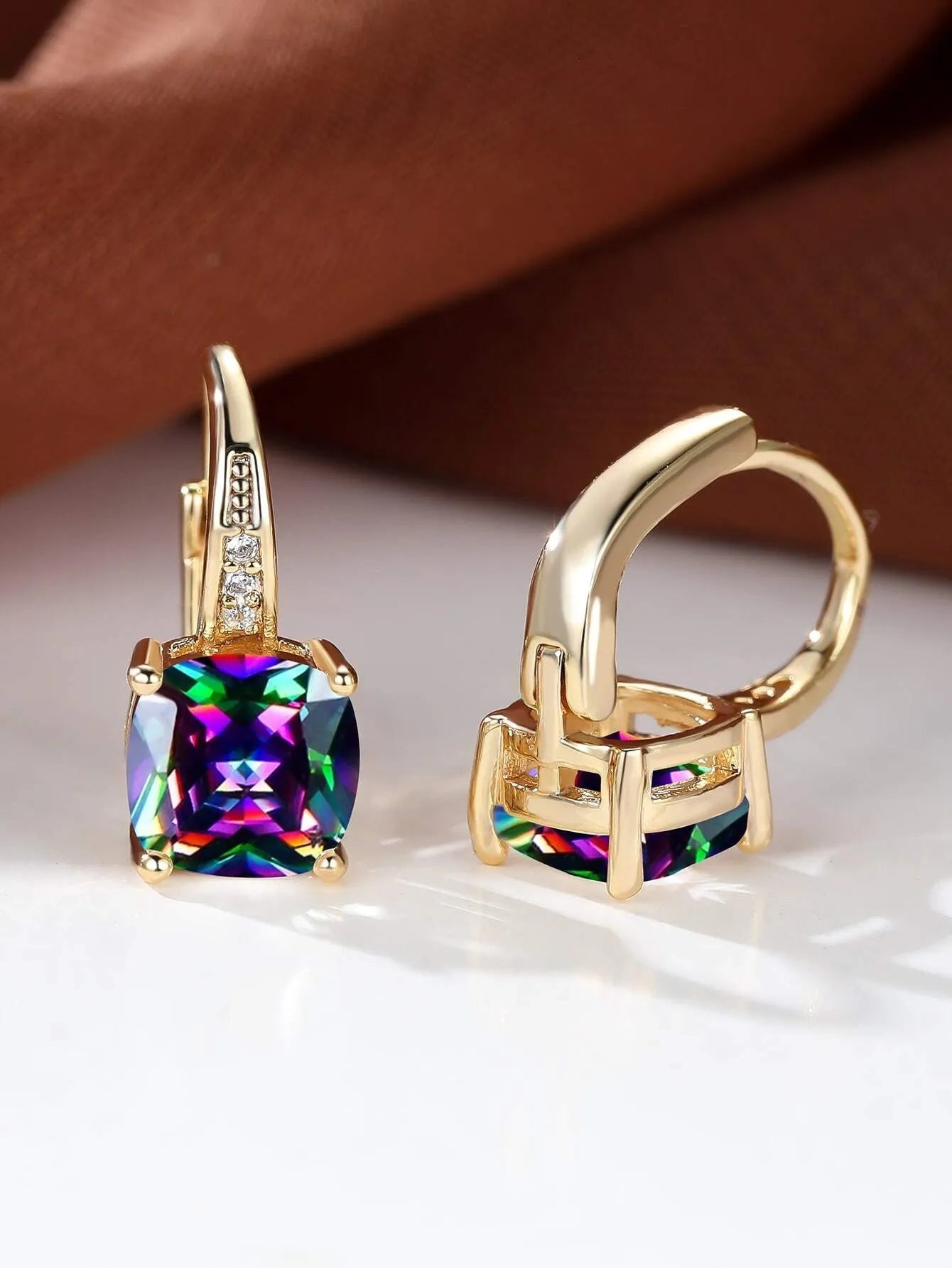 Geometric copper ear clip with colourful moissanite stones in quadrilateral pattern