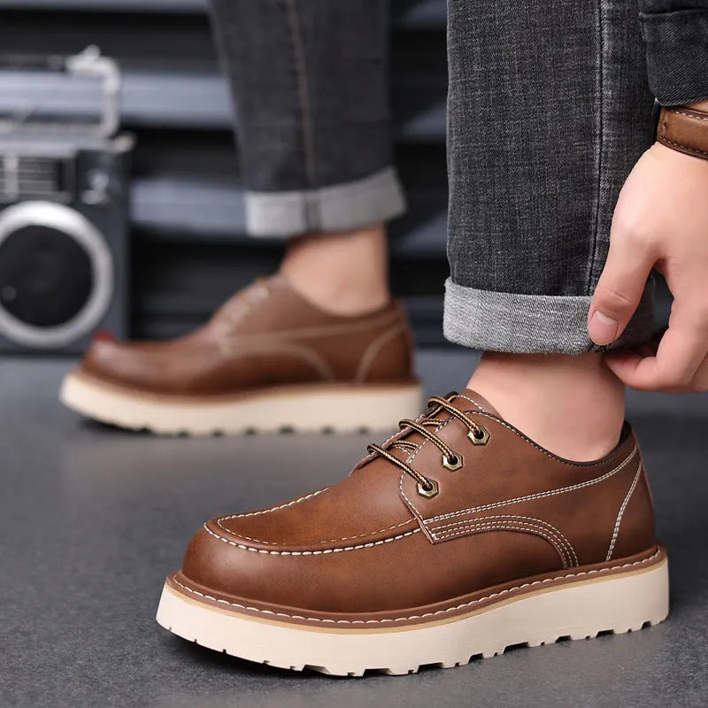 Men's black retro Martin-style low-top boots with round toe and non-slip rubber sole.