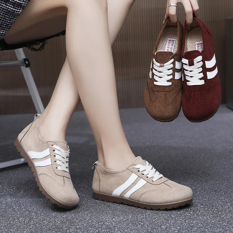 Women's vintage-style canvas sneakers with round toe and flat rubber sole in dark red colour