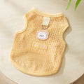 Green cat jumper with bear patch design showing breathable knitted fabric