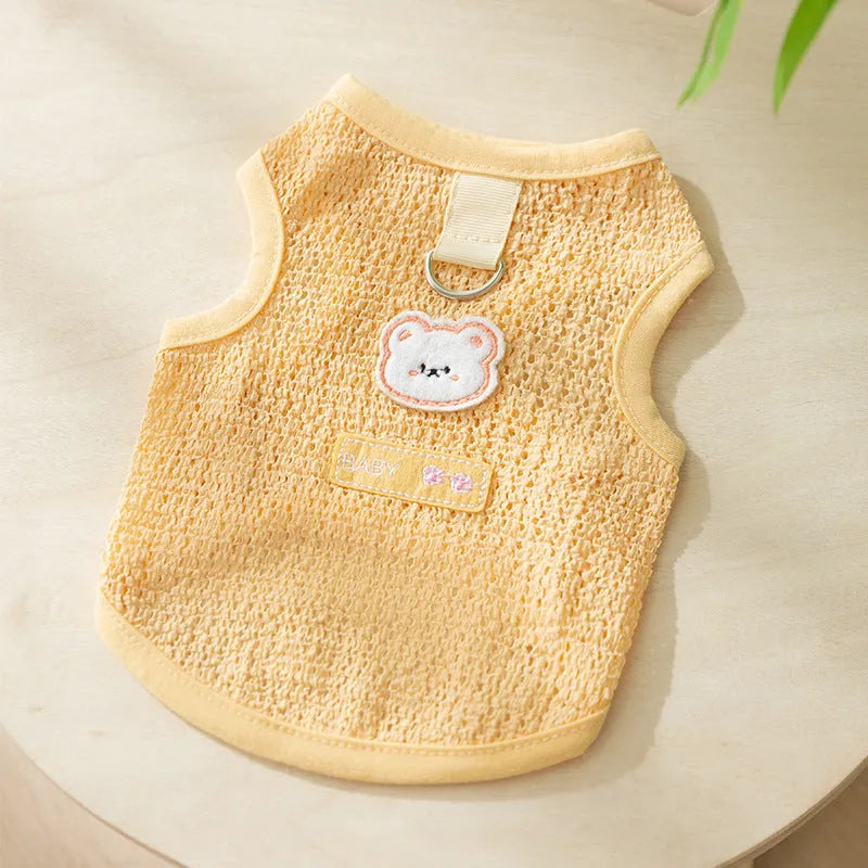 Green cat jumper with bear patch design showing breathable knitted fabric