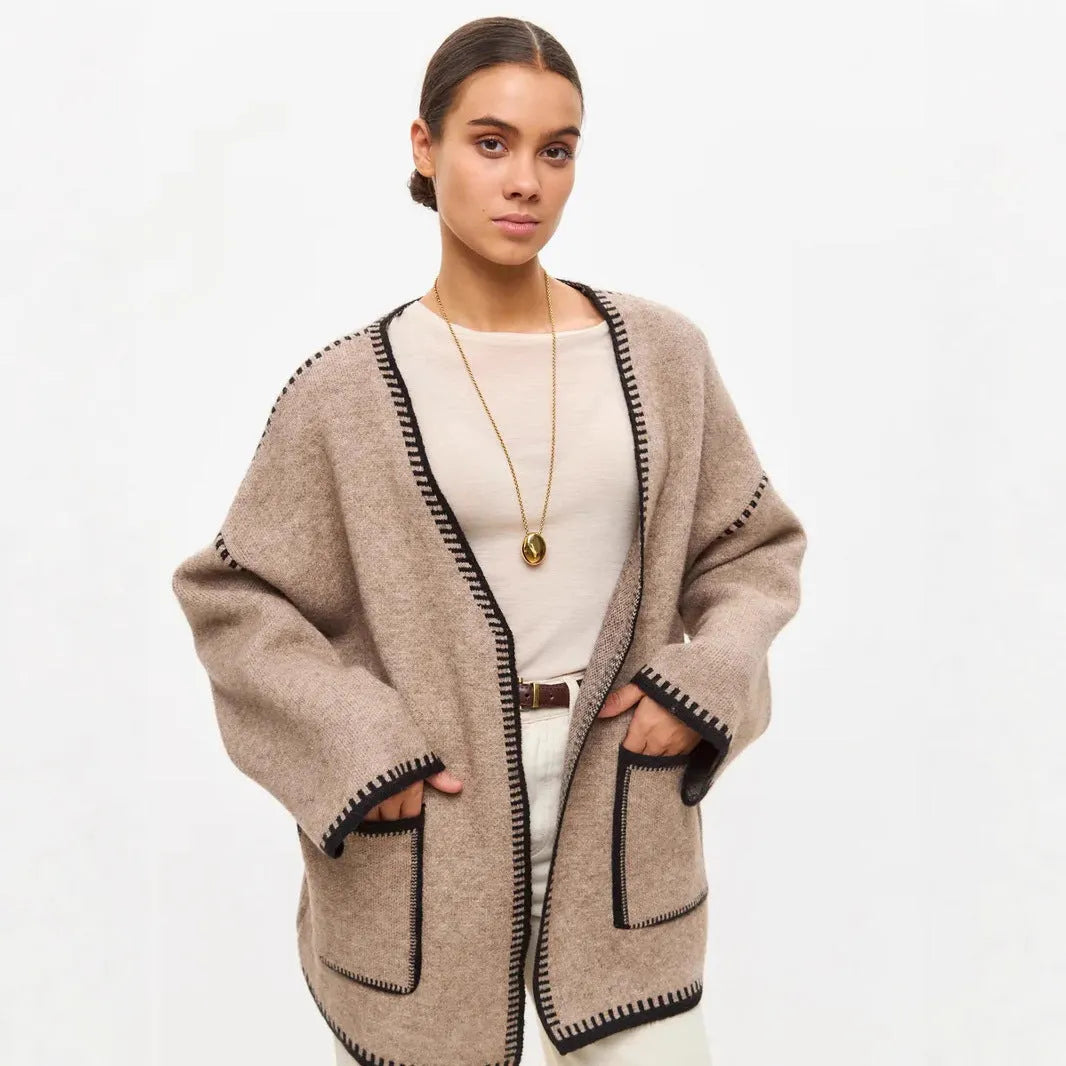 Lace-up front knitted cardigan in camel colour showing loose mid-length design and long sleeves