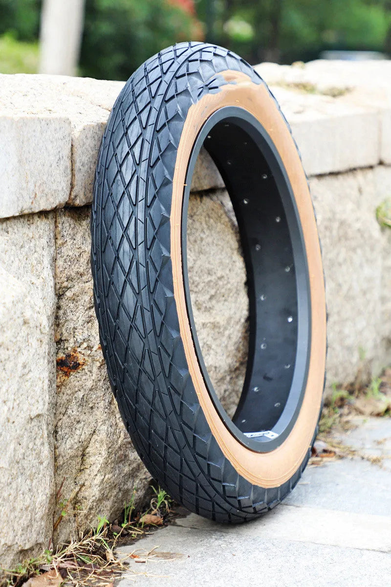 Brown rubber tyre for snowmobile and electric beach car showing 20×4.0 inch measurements