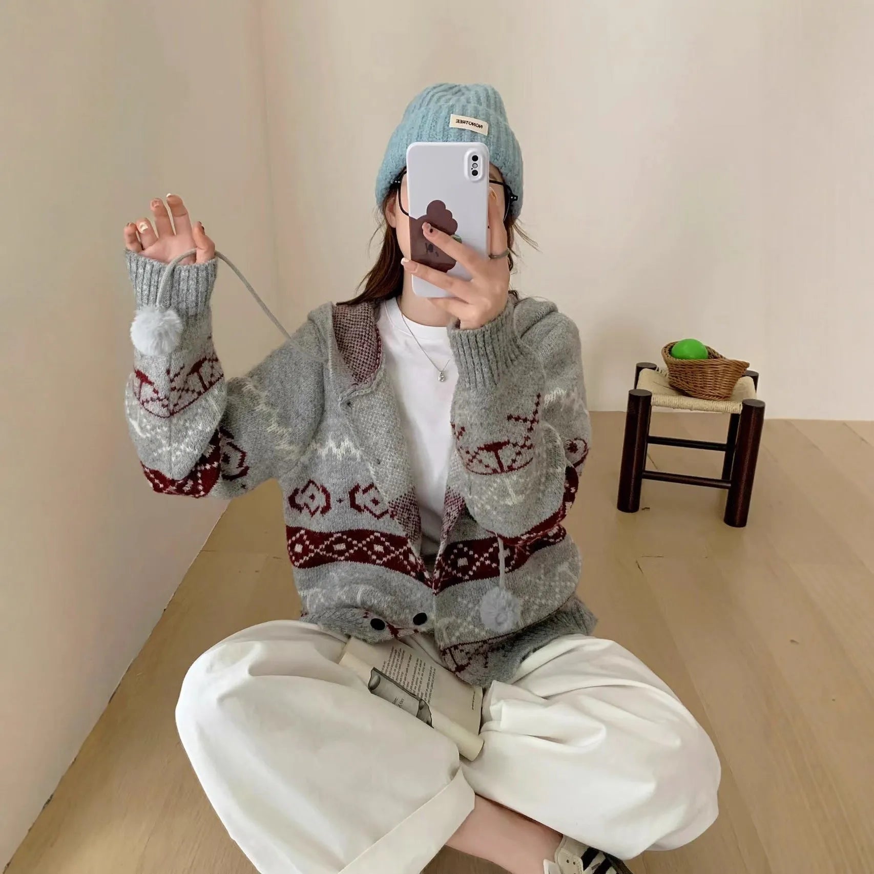 Geometric pattern brocade sweater coat in milky white colour with loose fit free size design