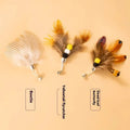 Three steel wire cat toy replacement heads with small flying insect designs in assorted colours