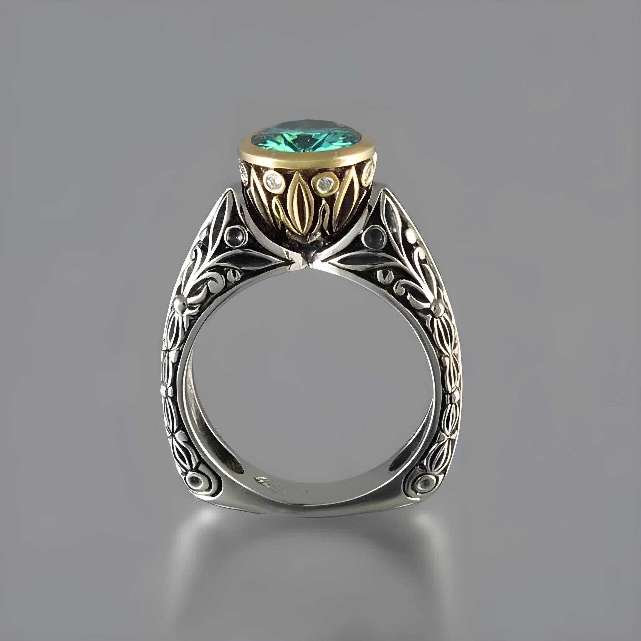 Gold-plated flower-shaped vintage ring with a green gemstone on a model's finger