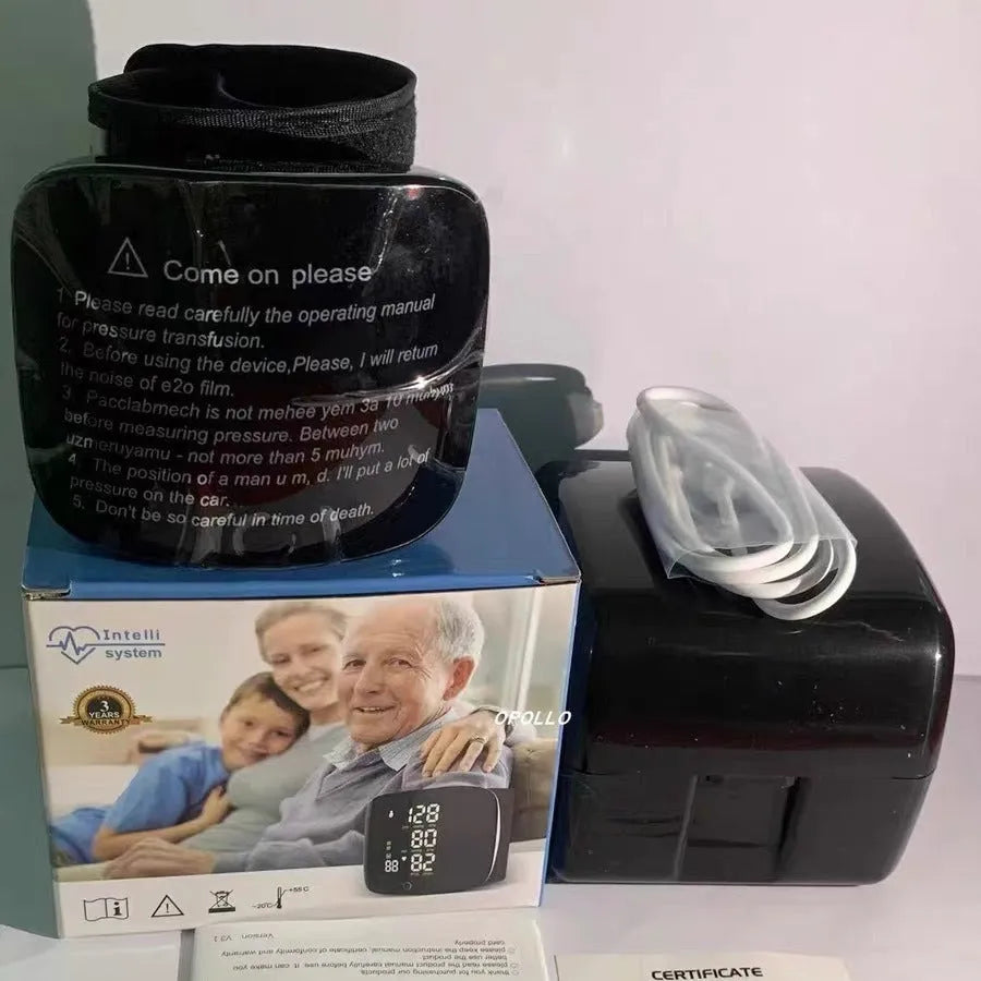 Black digital wrist blood pressure monitor with USB recharge port and display