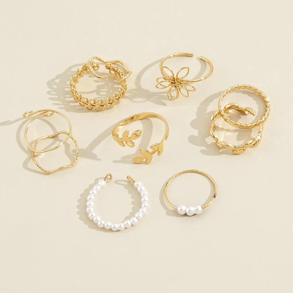 Gold openwork flower ring set showing floral design and glossy electroplated finish