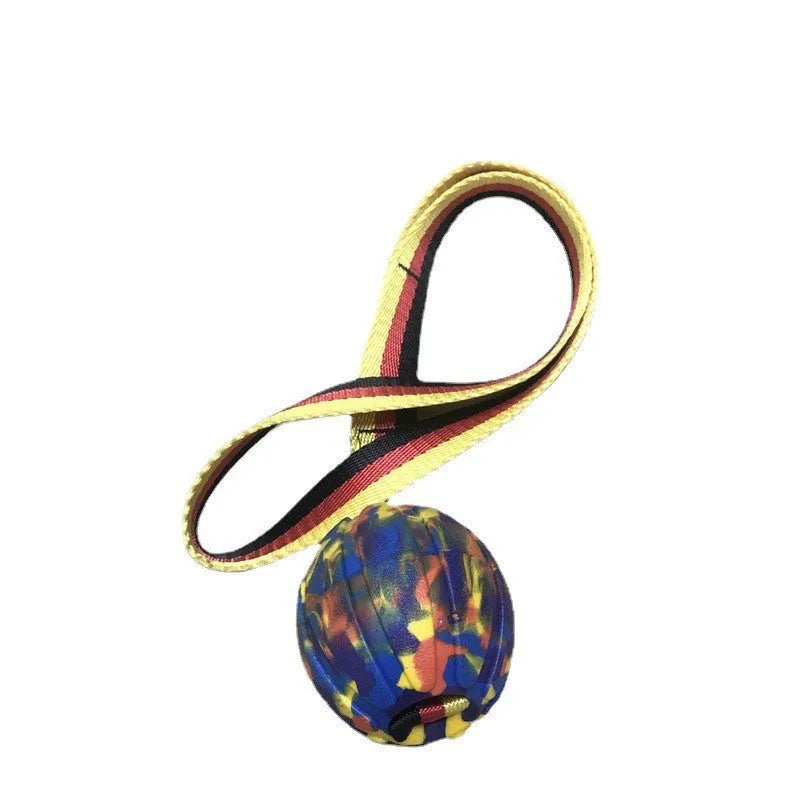 Floating camouflage and yellow EVA dog training balls with string tethers in three different sizes