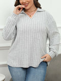 Women's plus size gray polo collar fleece shirt with lantern sleeves on a hanger.