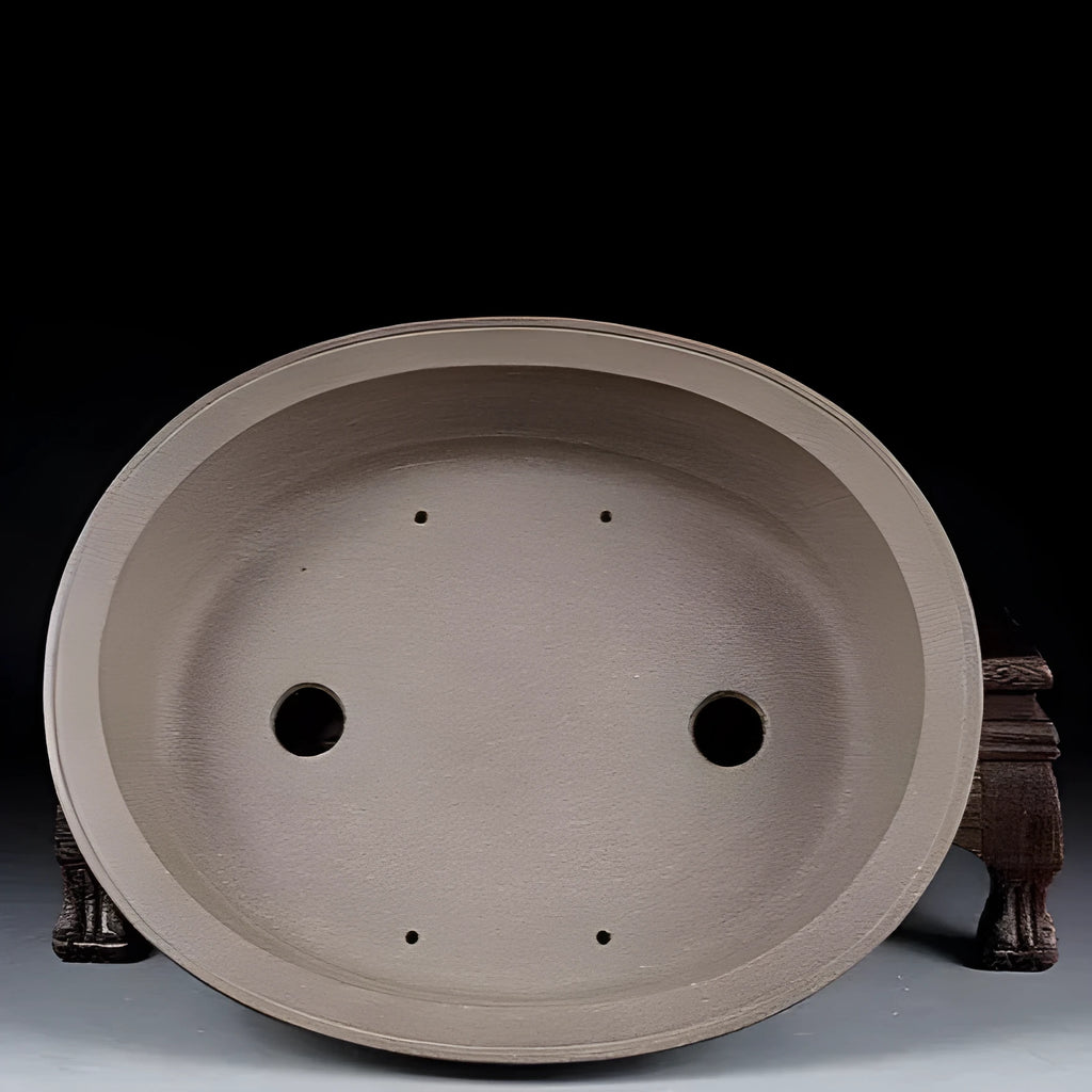 Handmade purple sand clay bonsai pot with antique oval design measuring 25x21x6.3cm