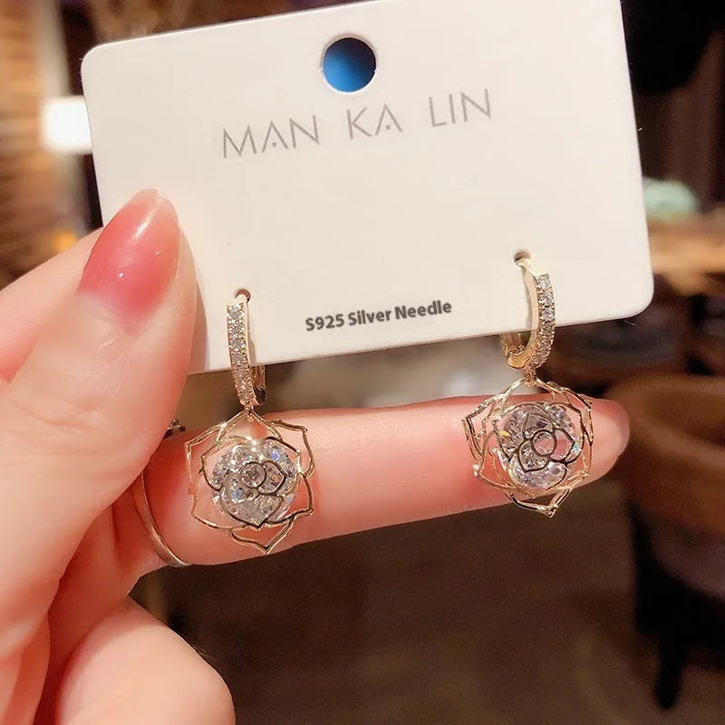 Geometric rose detail zircon earrings for women in copper, available in multiple colours.