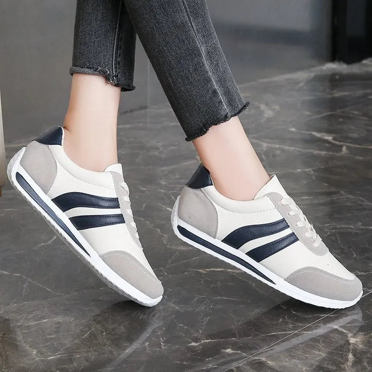 Red and blue lace-up running sneakers with mesh upper and rubber soles