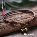 Adjustable nylon dog collar with a choice of brass bell or brass buckle in black, red, or coffee colour.