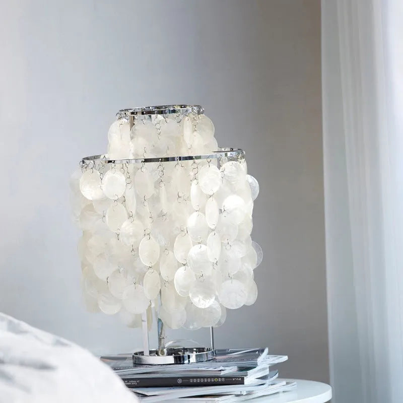 Modern shell design bedside table lamp in chrome or gold finish with slim profile