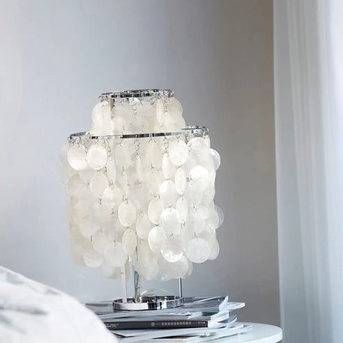 Modern shell design bedside table lamp in chrome or gold finish with slim profile