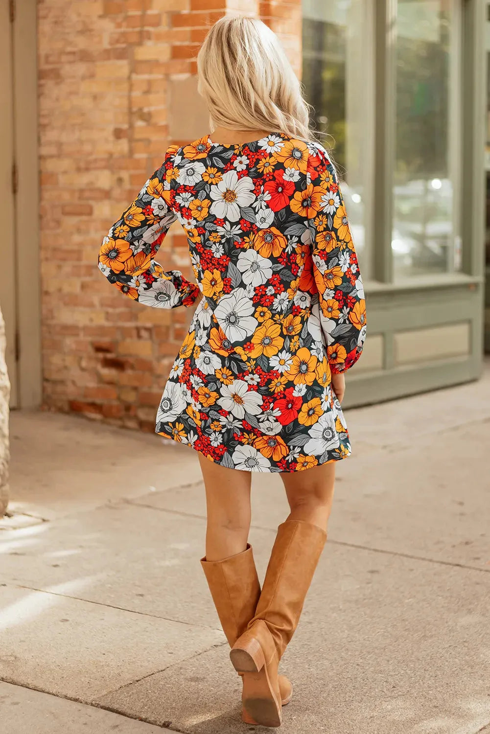 Orange floral print mini dress with striped and lace long sleeves and a V neckline.
