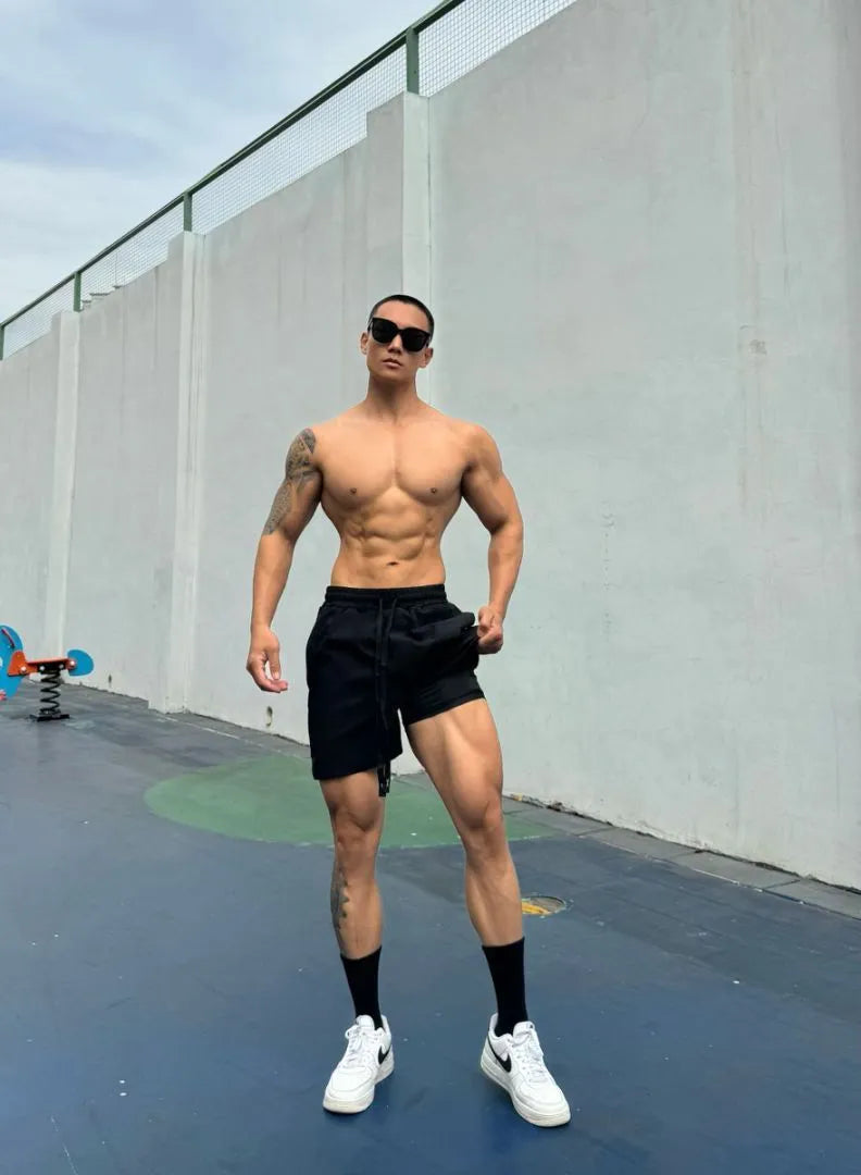 Men's ice silk quick-drying double-layer shorts in six colour options with quarter-length design