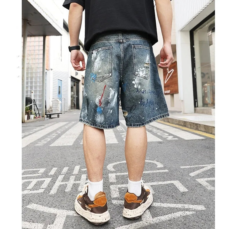Blue ripped men's denim shorts with straight-leg cut and zipper fly closure