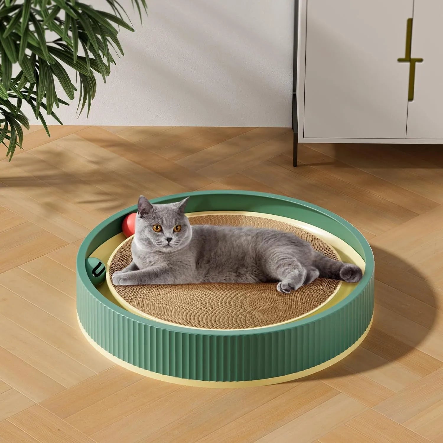 Large circular cardboard cat scratching board with integrated bell toys and refillable core