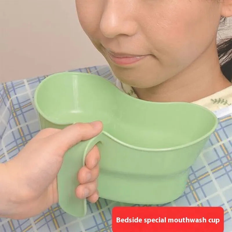 Green plastic nursing gargle cup with specialised spout for bedridden patient oral care