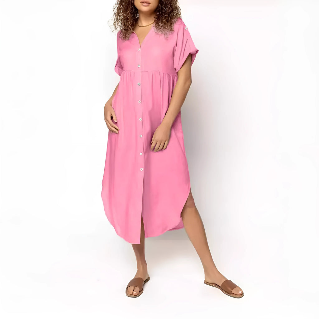 A woman wearing a casual solid-colour mid-length dress with a button-down front.