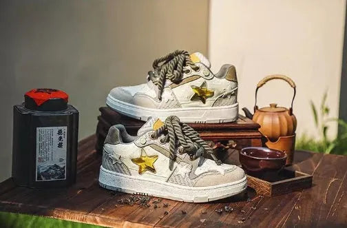 Green casual shoes with star pattern design, multi-material stitching, and rubber sole