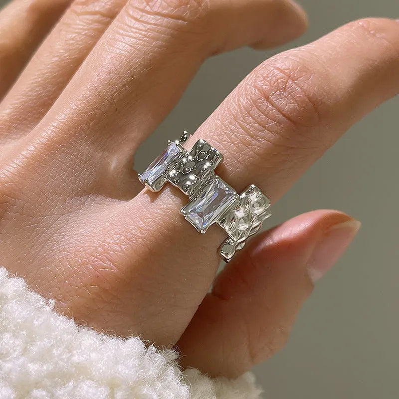Silver cross zircon ring with open geometric design and three-dimensional decoration