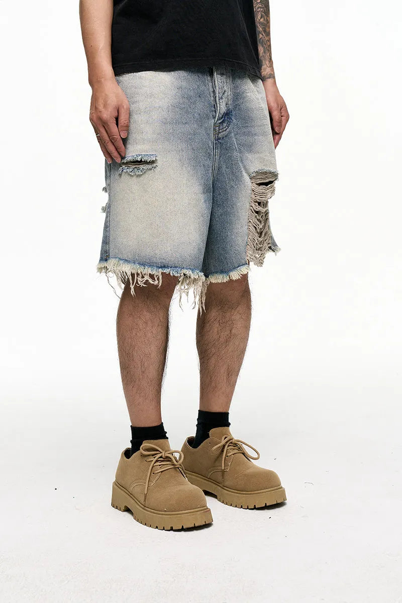 Light blue retro washed men's baggy denim shorts on a mid-waist model