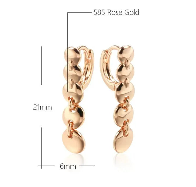Gold retro woven hoop earrings showing full circle and textured copper surface