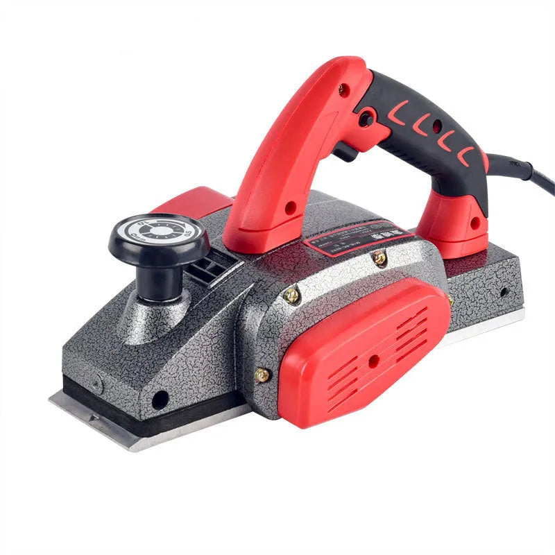 Red electric wood planer with aluminium housing showing 82mm planing width and power specifications