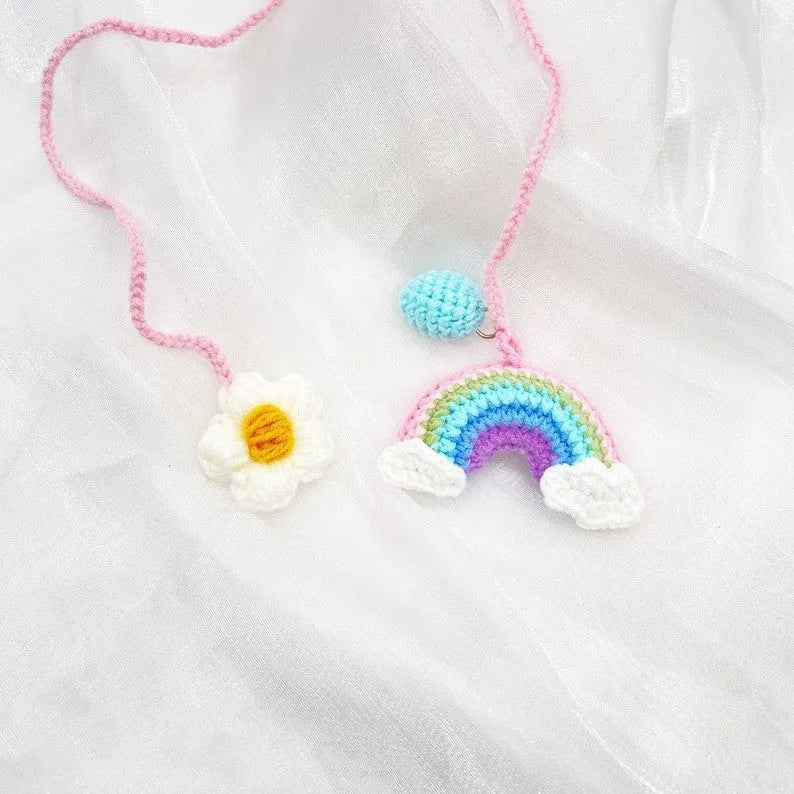 Handmade crocheted avocado car pendant with rainbow flower design in wool material