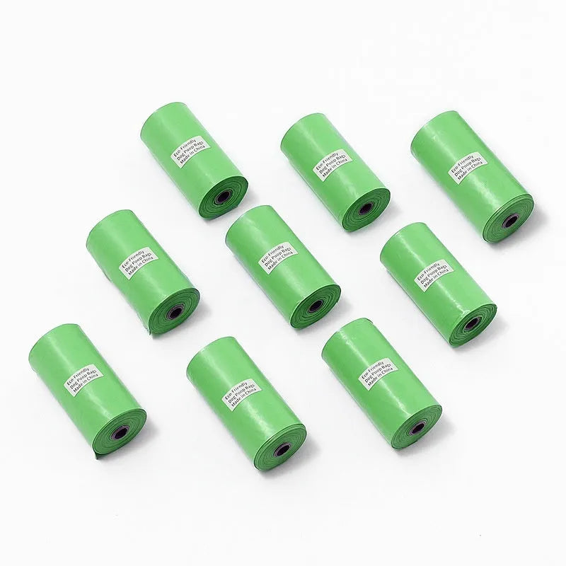 Degradable pet waste bags in green, black, blue, purple and orange colours with dispenser