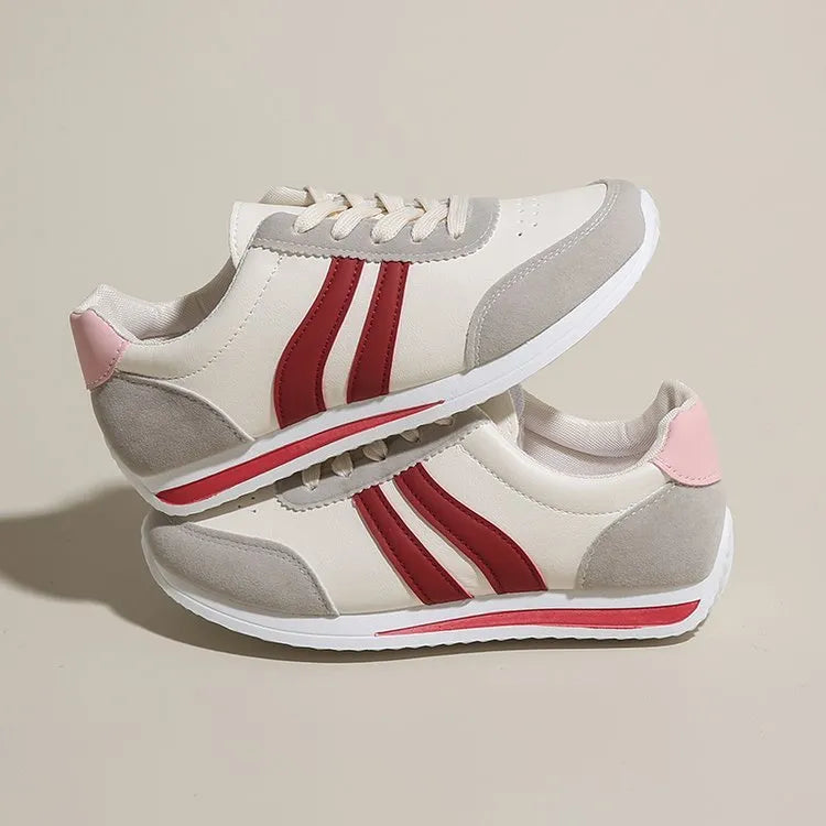 Red and blue lace-up running sneakers with mesh upper and rubber soles