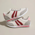 Red and blue lace-up running sneakers with mesh upper and rubber soles